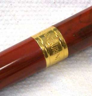 This Rare Yves Saint Laurent Ball Point Pen has a marbled look and 