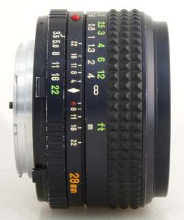 Minolta MD W.Rokkor 28mm f/3.5 lens with caps; Japan  