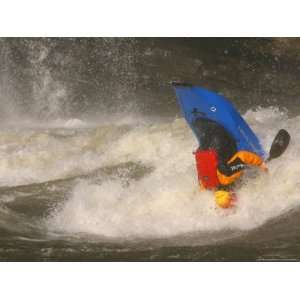 Whitewater Kayaker Upside Down Halfway Through a Loop Move National 