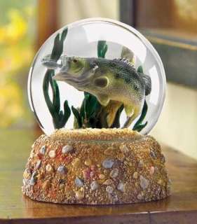 into this gleaming glass globe to behold a miniature underwater world 