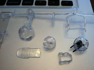 The clear plastic pieces are clear and some have been attached to the 