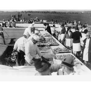   1928 graphic. Photograph shows men preparing meat and