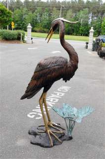 description new bronze egret fountain the water spits from the mouth 