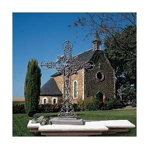  virgin mary in iron cross statue home garden with roses 