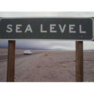  A Sign Declares Sea Level Along a Roadside Near Death 
