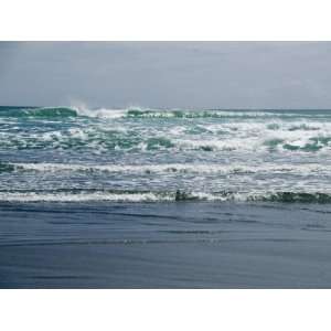  Waves Rolling on a Black Sand Beach in New Zealand 