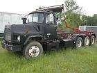 1998 MACK DM690S Roll Off Truck