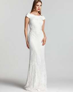   tadashi shoji s elegant lace gown is bedecked in sparkling beads for