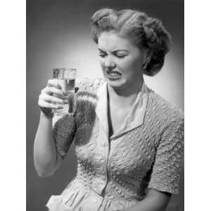  Woman Looking at Glass of Water in Disgust Photographic 