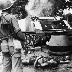  Phnom Penh a Soldier Stands over the Mutilated Body of a 