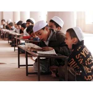  Students Read the Holy Quran During a Class in Herat 